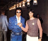 1973 Lake Tahoe shaking hands man Elvis in cracked blue jumpr blue belt